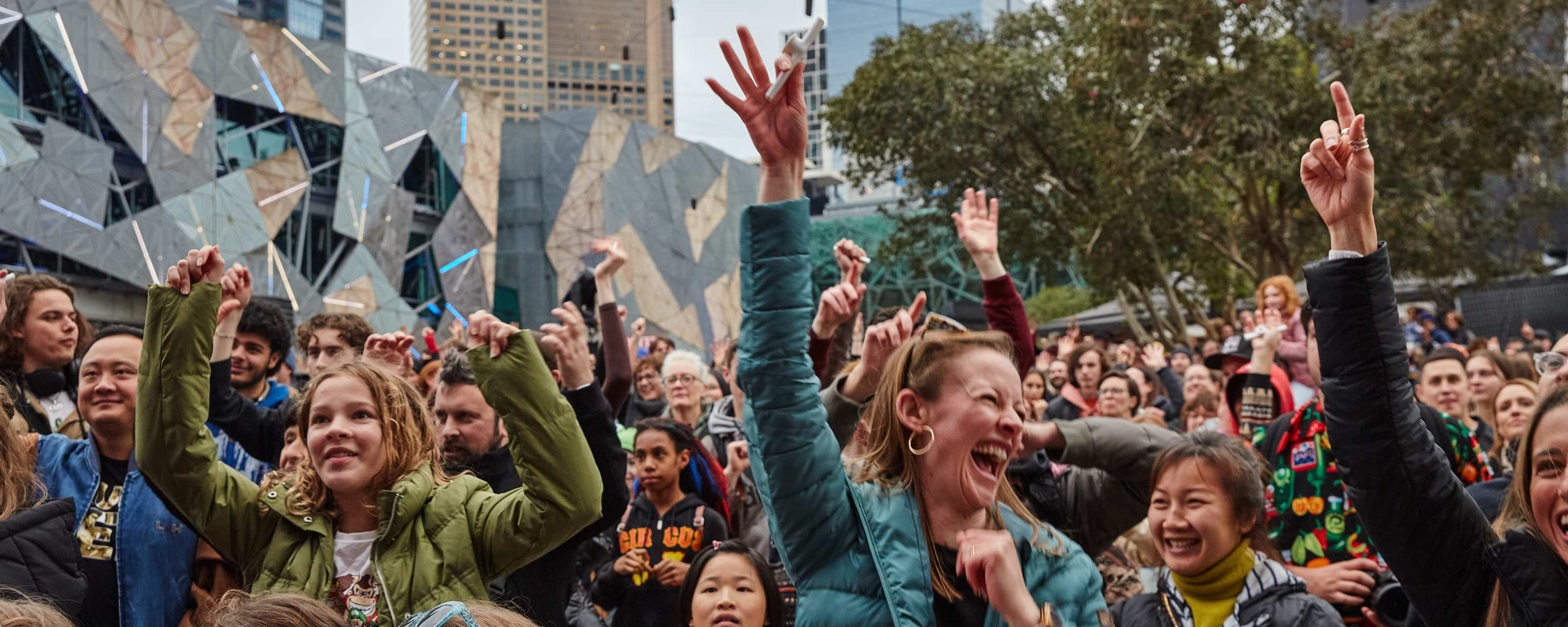 A crowd of happy people at Fed Square