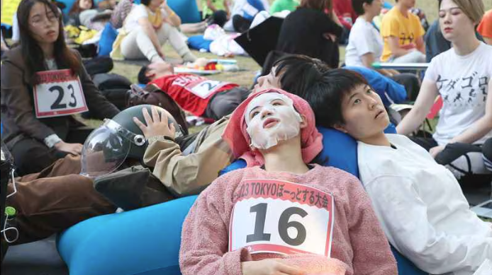 Competitors in the Space Out Competition lay back on bean bags, staring into blank space 