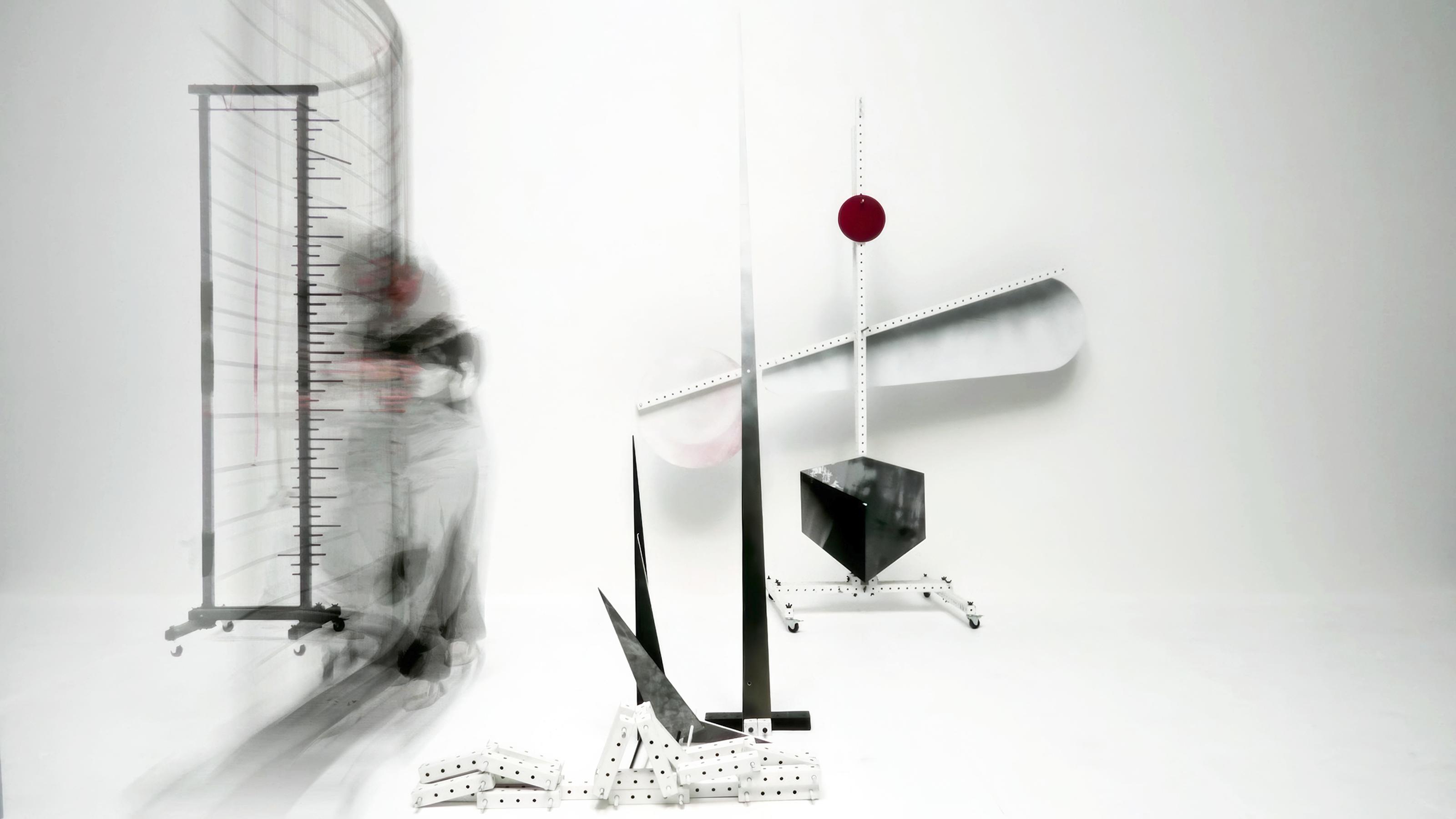 Abstract art in motion with a blurred figure and geometric shapes.