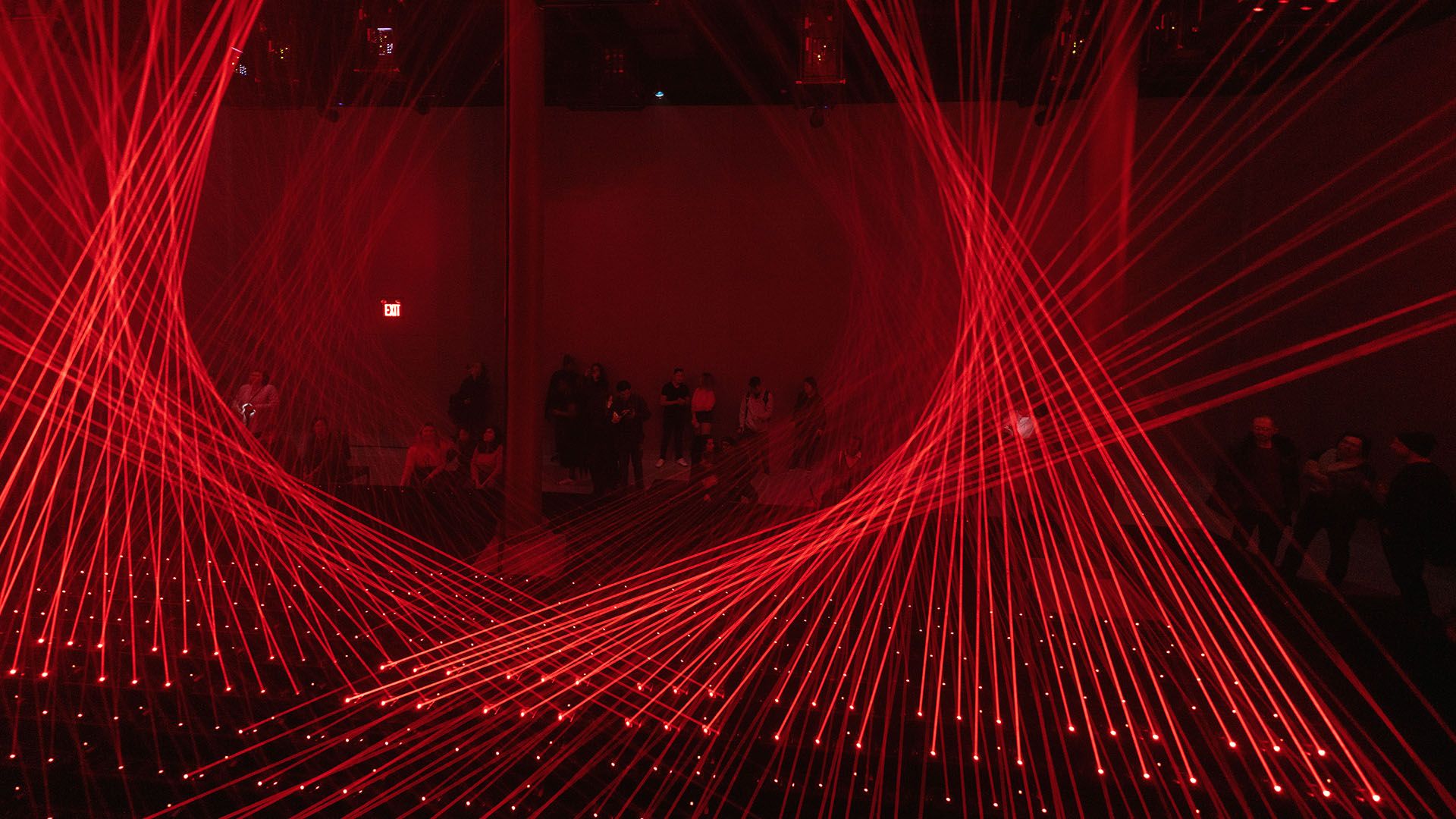 Two sets of lasers weave in and out of like a funnel web